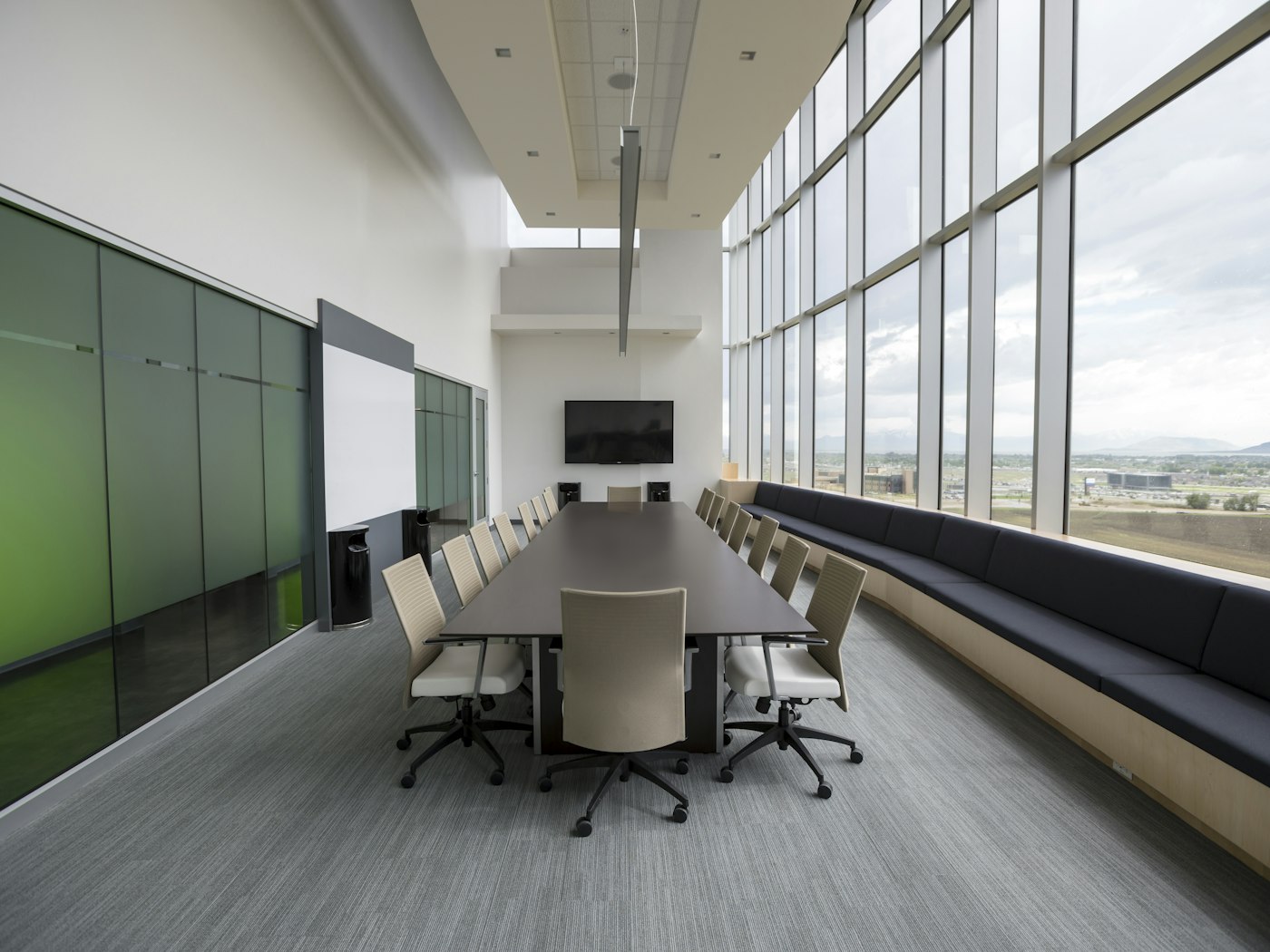 Long meeting table in a bright conference room